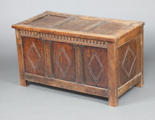 An 18th Century oak coffer of panelled construction with hinged lid 64cm h x 113cm w x 57cm d  