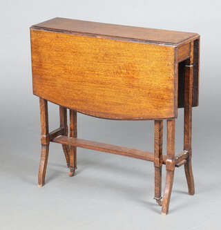 An Edwardian oak Sutherland table raised on slender outswept supports 68cm h x 68cm w x 19cm d 