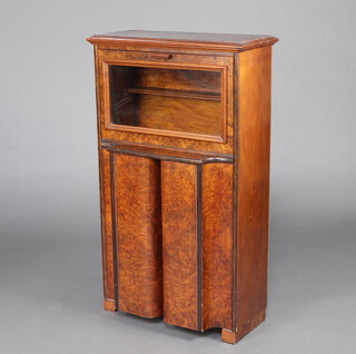 A 1930's figured walnut cabinet with fall front enclosed by pair of panelled doors 113cm h x 67cm w x 40cm d 