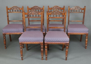 A set of 6 Victorian carved mahogany bar back dining chairs with shaped mid rails, bobbin turned decoration and over stuffed seats, raised on turned supports 89cm h x 45cm w x 43cm d 