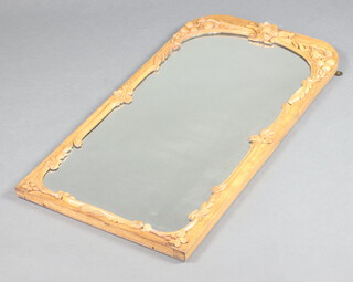 A Victorian style arched plate mirror contained in a carved walnut frame decorated fruits 102cm x 51cm 