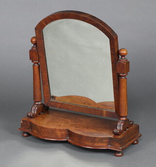 A 19th Century arched plate dressing table mirror contained in a mahogany swing frame, base of serpentine outline, 76cm h x 68cm w x 30cm d 