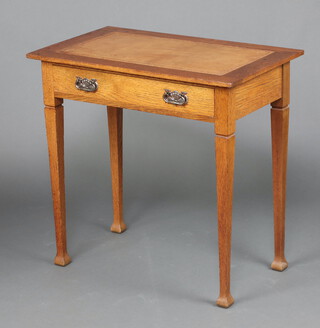 An Edwardian rectangular oak side table with brown inset writing surface fitted a drawer, raised on square tapered supports 74cm h x 76cm w x 46cm d 