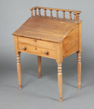 A Victorian bleached mahogany clerk's slope with 3/4 gallery and hinged lid above 1 long drawer, raised on turned supports 107cm h x 76cm w x 51cm d  