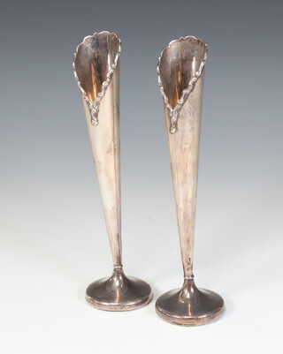 A pair of tapered silver spill vases Birmingham 1924, 20cm, weighted bases 