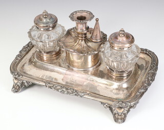 A Victorian silver plated ink stand with lidded box, chamber stick, finial and 2 mounted glass bottles with William IV silver lids , bearing armorial 26cm 