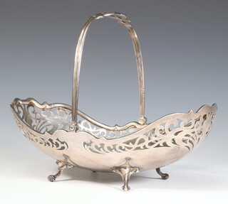 A George V pierced silver swing handle basket on scroll feet 471 grams, maker Mappin and Webb, 25cm, Sheffield 1913 