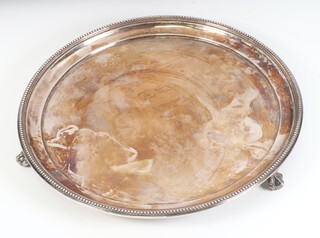 A Victorian circular silver salver with beaded rim on claw and ball feet, London 1875, 25cm, 505 grams 