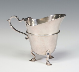 A Victorian silver Britannia standard cream jug with strap work decoration on pad feet and S scroll handle, London 1881, by Holland Aldwinkle and Slater, 124 grams, 9cm 