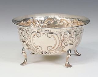 A Victorian repousse silver bowl with vacant cartouche and floral decoration on pad feet, Birmingham 1882, 90 grams, 9.5cm  