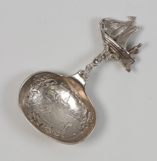 A Continental white metal caddy spoon with galleon handle by Berthold Hermann Muller, 17 grams 