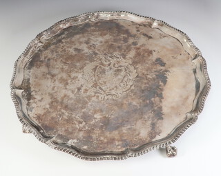 A George III silver salver with egg and dart border, claw and ball feet and engraved crest, London 1774, maker Richard Rugg I, 1759 grams, 41cm  