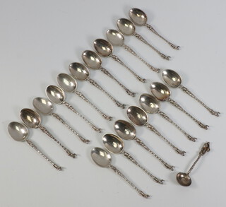 Eighteen Continental metal apostle spoons and a ditto mustard spoon, 168 grams 