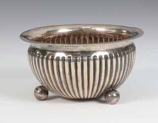 A Victorian silver circular bowl with ribbed decoration on ball feet, Birmingham 1886, 49 grams, 8cm  