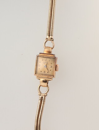 A lady's E Moser wristwatch contained in an 18ct yellow gold case on a yellow metal strap, gross weight including glass 13.5 grams 