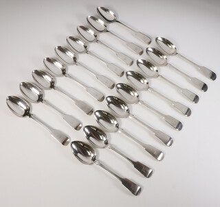 Eighteen Victorian silver fiddle pattern dessert spoons with engraved armorial, Exeter 1854, 650 grams 