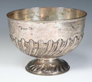 An Edwardian silver repousse flower bowl with demi-fluted decoration, London 1904, 332 grams, 13cm, with presentation inscription 