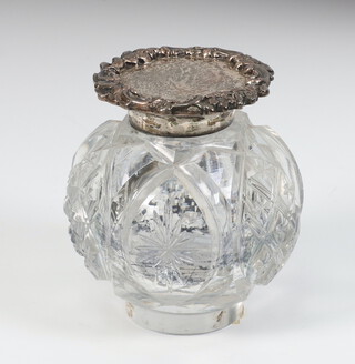 A Victorian silver mounted cut glass inkwell with scroll lid, London 1885, 7cm 