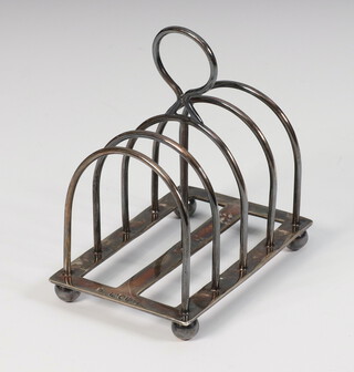 A Victorian silver 5 bar dome topped toast rack on bun feet, London 1883, 85 grams 