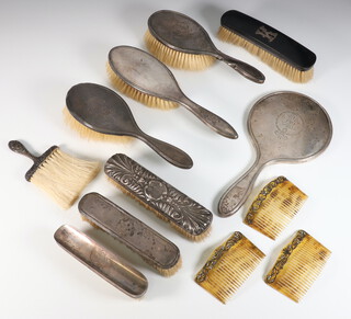 A pair of Edwardian silver mounted hairbrushes, ditto clothes brush, hand mirror, 3 clothes brushes, hair brush and a crumb brush, rubbed marks 