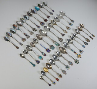 A quantity of 800 standard, 925 standard and sterling silver enamelled souvenir spoons, 478 grams 