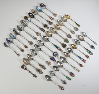 A quantity of 800 standard, 925 standard and sterling silver enamelled souvenir spoons, 466 grams