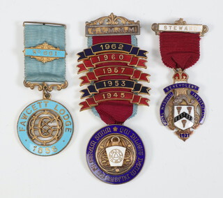 A Masonic silver gilt and enamelled Centenary jewel Fawcett Lodge no.661, a Mark silver charity jewel with bars and 1 other charity jewel 