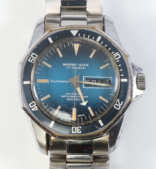 A gentleman's steel cased Marine-Star automatic day/date wristwatch with black bezel and blue dial contained on a steel bracelet, contained in a 35mm case in working order