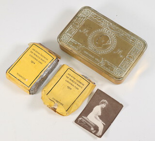 A Christmas 1914 tin containing a packet of tobacco, empty cigarette packet and photograph of Queen Mary 