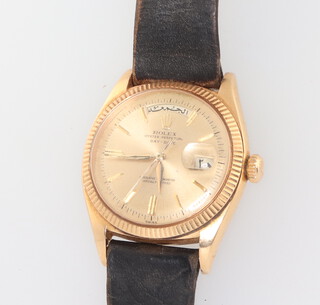 A gentleman's 18ct yellow gold day/date Rolex Oyster Perpetual wristwatch with cyclops cover to date, the days and numerals in Arabic script, contained in a 35mm case, the case numbered 1803, the movement 1555 with presentation inscription