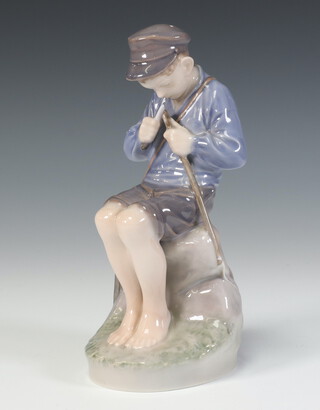 A Royal Copenhagen figure of a seated boy whittling 905 19cm 