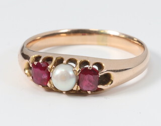 A Victorian yellow metal pearl and ruby ring, size N, 3.4g