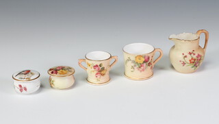 A Royal Worcester blush porcelain miniature mug decorated with flowers 4cm, a 2 handled ditto 3.5cm, a jug G1022 4.5cm (a/f) and 2 rouge pots decorated with a bird and flowers 3cm 
