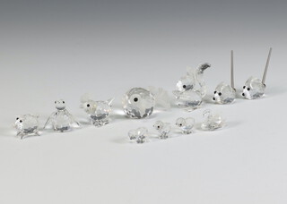 Eleven Swarovski Crystal miniature animals comprising blowfish 5cm, cockerel 3cm, squirrel 5cm, 2 mice 2cm, piglet 2cm, penguin 3cm, swan 2cm, 3 chicks 1cm, all boxed 