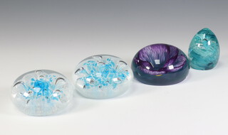 Four Caithness paperweights - Thoughtfulness dated 2001 numbered 628 9.5cm, Crystal Carousel (blue) T59873 dated 2002 9cm, Blessings 55829 7cm and Crystal Carousel (blue) T60757 10cm, all boxed 