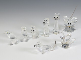 Eight Swarovski Crystal animals comprising fox 5cm, owl 6cm, kingfisher 7cm, cat 7cm, dog 7cm, dachshund 8cm, butterfly 5cm and mouse 7cm, all boxed