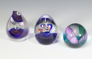 Three Caithness crystal paperweights - Alchemist no.156 of 750 10cm, Silver Jubilee no.10 of 100 10cm and Firework Orchid no.192 of 500 9cm, all boxed 