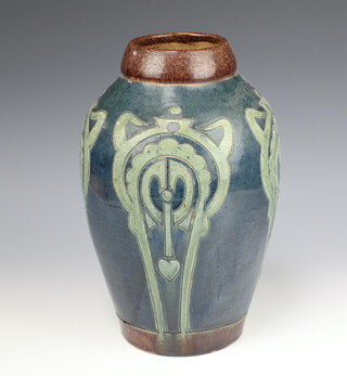 A Brannam Barum style tapered cylindrical vase decorated with geometric patterns on a blue ground 34cm 
