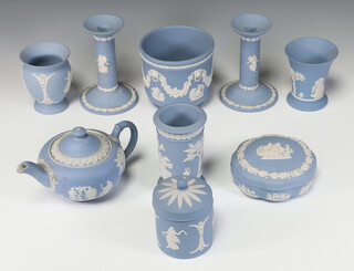 A Wedgwood blue Jasperware teapot, pair of candlesticks, 3 vases, jardiniere, box and pot 