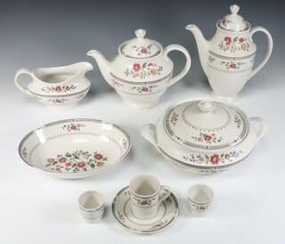 A Royal Doulton Kingswood pattern coffee, tea and dinner service comprising teapot, coffee pot, milk jug, 2 cream jugs, sugar bowl and lid, 4 coffee cans, 6 saucers, 8 tea cups (4 seconds), 14 saucers (1 second), 7 tureen and covers (3 covers a/f), 2 sauce boats and stands, 17 dinner plates (1 second), 9 medium plates, 17 small plates, 14 soup bowls, 3 oval meat plates, sandwich plate, 2 oval vegetable dishes (both seconds), 6 dessert bowls (2 seconds), a bowl and 9 egg cups  