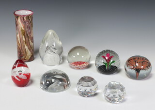 A Caithness Crystal paperweight 8cm decorated with a flower, together with 7 other paperweights and a vase 