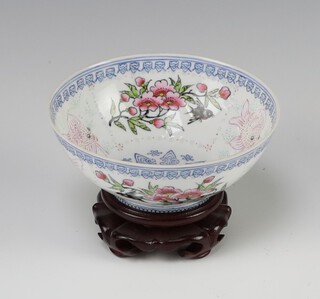 A 20th Century Chinese eggshell porcelain bowl decorated flowers and carp 5cm x 10cm on a hardwood stand 