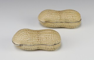 A pair of Chinese ceramic giant nutshells each containing 2 peanuts 14cm