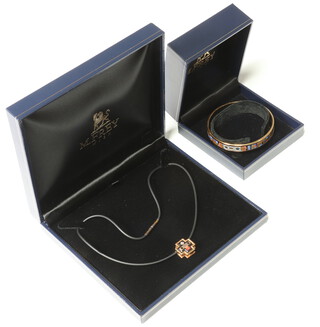 A Michaela Frey enamelled bangle together with a ditto cross pendant, both boxed 