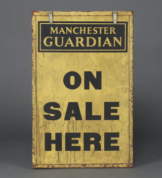 A black and yellow painted plywood newspaper stand sign for the Manchester Guardian 80cm h x 51cm 
 