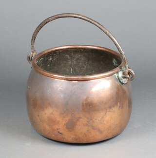 A 19th Century circular copper pot with iron swing handle 28cm x 35cm 