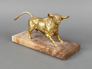 A gilt metal figure of a standing bull raised on a rectangular marble base 13cm h x 24cm w x 9cm d 