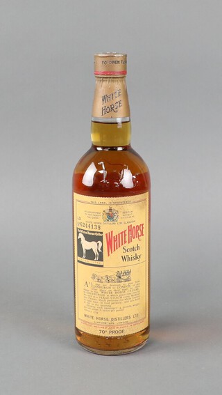 A bottle of 1960's White Horse Scotch Whisky no.6244138, 70 percent proof, the reverse with pink label 