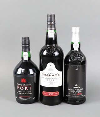 A litre bottle of Graham's Late Vintage bottled port, a 75cl bottle of Dows Midnight Finest Reserve Port and a 75cl bottle of vintage character port  