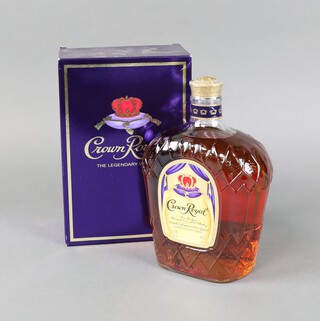 A litre bottle of Royal Crown Fine De Luxe blended Canadian Whisky 40% proof, contained in a cardboard box and with presentation cloth bag 